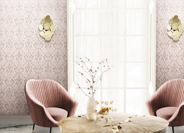 Elegant living room featuring pink damask wallpaper, velvet armchairs, and luxury gold wall sconces.
