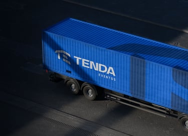 Blue Tenda Eventos logistics truck trailer transporting event equipment on a road.