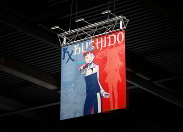 a cover art hanging from a ceiling in a building