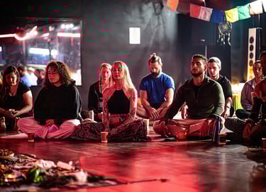 a group of meditators sat on the floor meditating