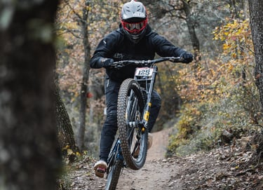 a man riding a bike down a trail