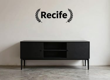 Minimalist interior of a building in Recife, featuring a deep matte black furniture piece against a soft off-white wall. High-quality editorial photography style.