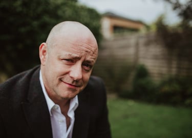Drew outside his studio in the garden