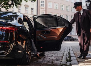 a man in a suit and hat walking down the street