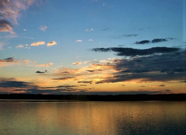 A color photograph of a sunset in Back Cove near Portland, Maine