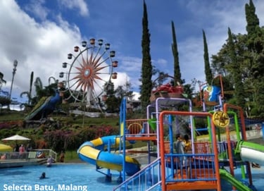 Selecta Batu Malang, taman air yang menampilkan seluncuran warna-warni dan kincir raksasa di bawah l