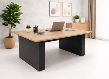 Modern wood and metal executive desk in a bright home office with a laptop and potted plants.