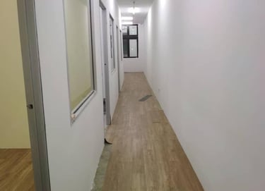 Suasana Renovations office corridor interior design, flooring, and partition work.