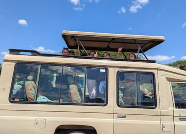 Tourists exploring Tarangire National Park in a safari vehicle on a Tanzania wildlife tour.
