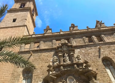 Baroque facade of San Juan del Mercado Church, a historic landmark in Valencia's vibrant Central M.