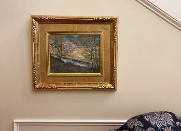 a painting of the french countryside on a wall