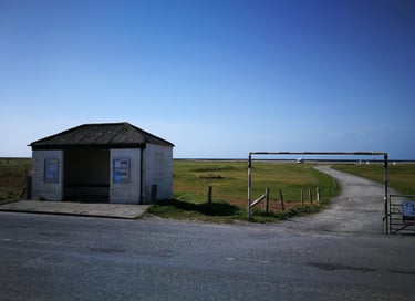 Ynyslas turn bus stop and track leading into the campervan car park