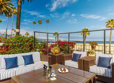 The Milo Santa Barbara outdoor lounge with champagne and strawberries overlooking the ocean