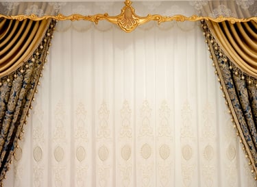 Elegant luxury gold and blue damask curtains with white lace sheers and ornate window valance decor.