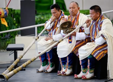 bhutanese-men-using-their-local-version-trumpet-at-the-masked-dance-festival-in-the-capital-Thimphu