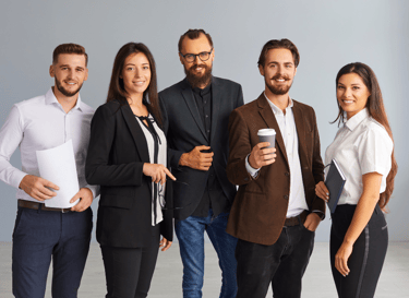 a group of business people standing in a room