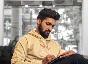 Photo of a Tattoo Artist designing on Ipad