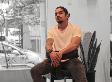 Photo of a Tattoo Artist posing on a chair