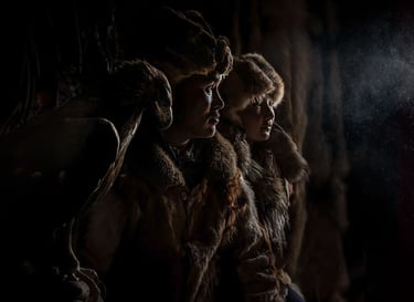 Mongolian eagle hunters in furs in ger