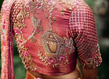 Women wearing ping blouse with aari work design