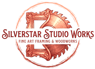 Silverstar Studio Works logo featuring a copper picture frame and saw blade for art framing and woodwork.