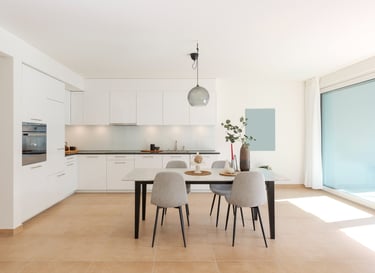 a dining room with a table and chairs