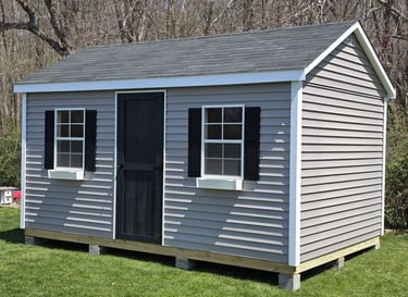 10x16 vinyl storage shed custom built in Pembroke, Massachusetts, low-maintenance outdoor storage.