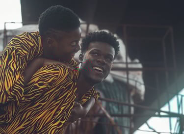 a man and a woman are smiling and laughing