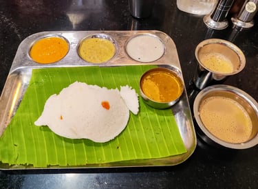 Traditional Tamil Nadu breakfast plate with idli, chutneys, and filter coffee