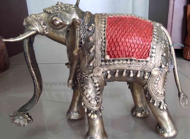 Artisan-made tribal brass elephant featuring red-painted design on the back-Meant for export