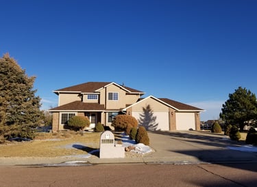 a house with a mailbox and mailbox in the driveway