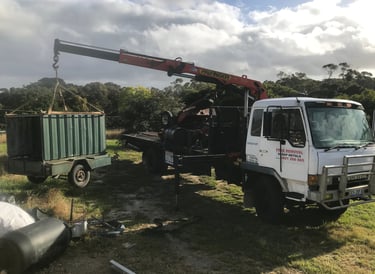 Crane truck loading scrap metal