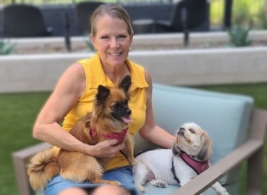 Lady sitting with two dogs