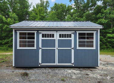 Colonial shed with spring trees and grass