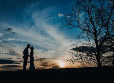 a couple backlit at sunset