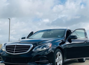 Black Mercedes benz in parking lot