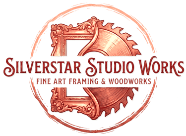 Silverstar Studio Works logo featuring a copper picture frame and saw blade for art framing and woodwork.