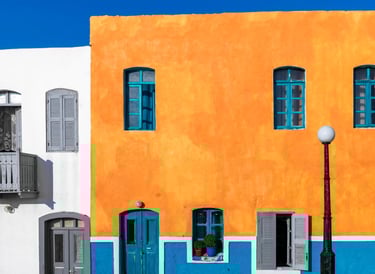 a building with a blue sky and a street light