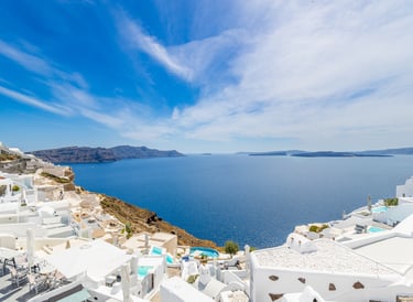 Santorin a view of a view of a sea and a blue sky