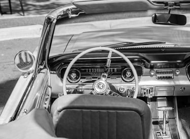 a ford Mustang car dashboard with a steering wheel and dashboard