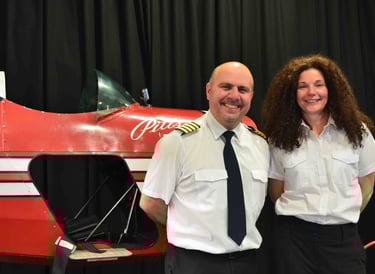 two people and a plane fuselage 