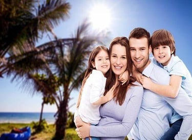 Smiling family standing together outdoors, expressing love and togetherness.