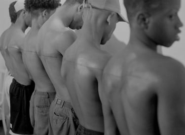 Santiago Sierra – 160 cm Line Tattooed on 4 People (2000)