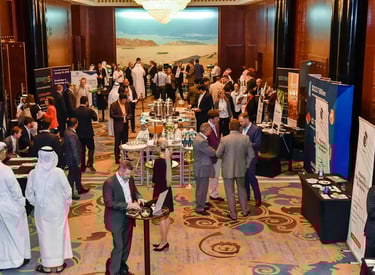 Event Photography - a group of people standing around a table with a laptop