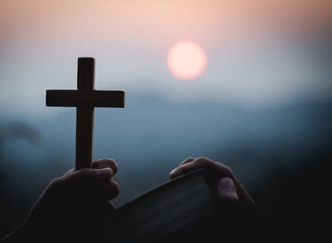 man holding a cross