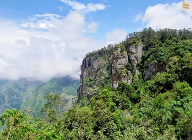 Pillar Rocks standing tall with the scenic valley in the background.