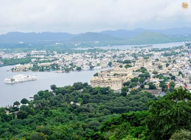 Panoramic hilltop view of Lake Pichola, City Palace, and Fateh Sagar Lake as seen from Karni Mata Temple in Udaipur.