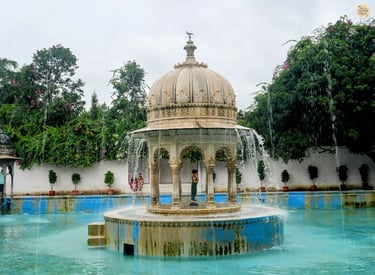 Fountain courtyard surrounded by greenery at the royal Saheliyon ki Bari  in Udaipur Rajasthan