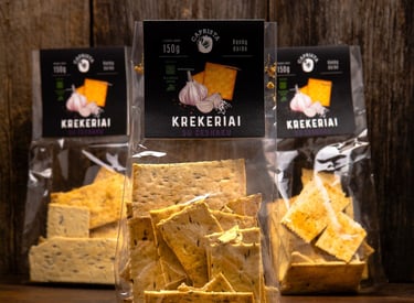 three  bags of crackers  on a table