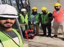 a group of men in safety vests and safety vests